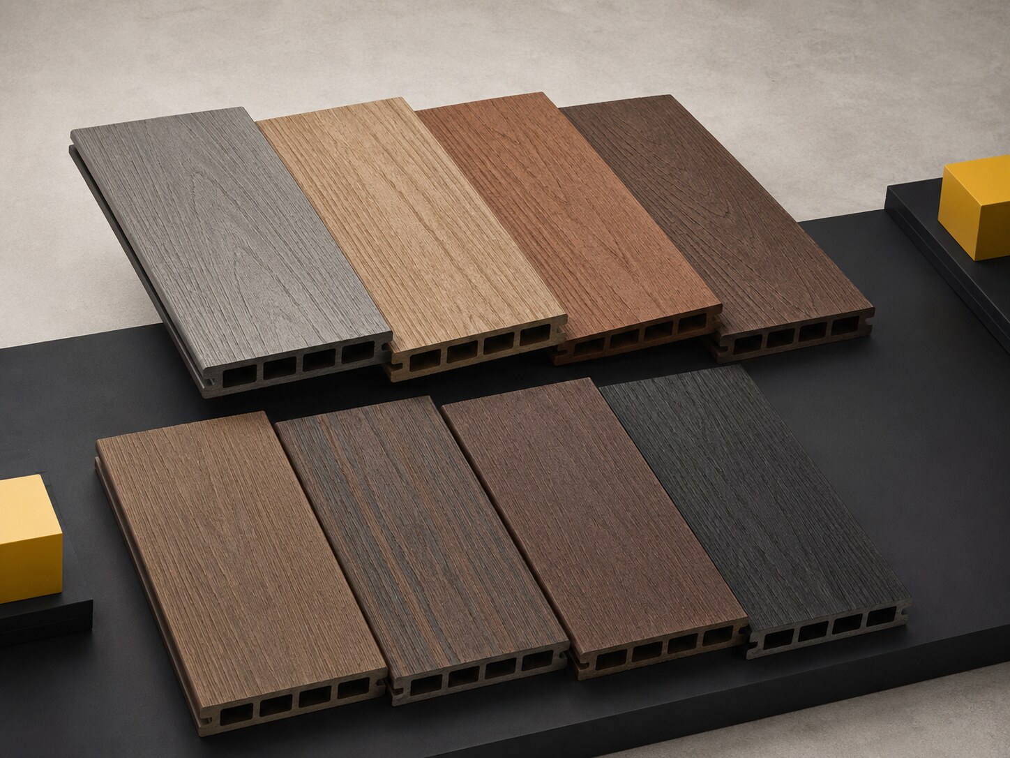 Composite decking boards in a range of wood-tone colors
